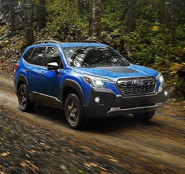 A 2022 Forester driving on a highway. | DELLA Subaru of Plattsburgh in Plattsburgh NY
