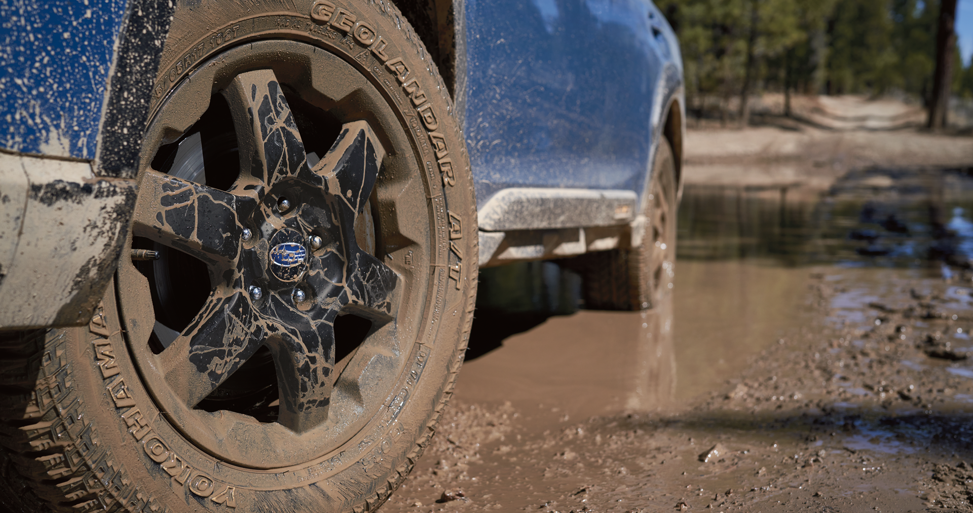 A close-up of the 17-inch off-road wheels and all-terrain Yokohama GEOLANDAR® tires on the 2023 Outback Wilderness. | DELLA Subaru of Plattsburgh in Plattsburgh NY