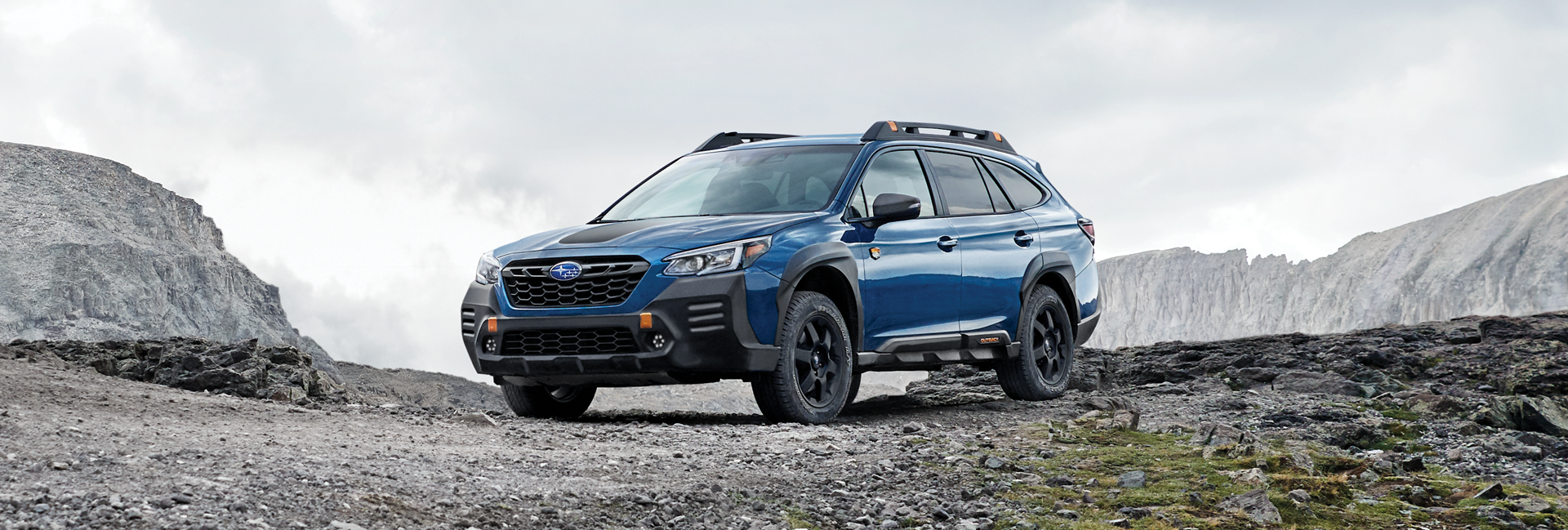 A 2023 Outback Wilderness parked in the mountains. | DELLA Subaru of Plattsburgh in Plattsburgh NY